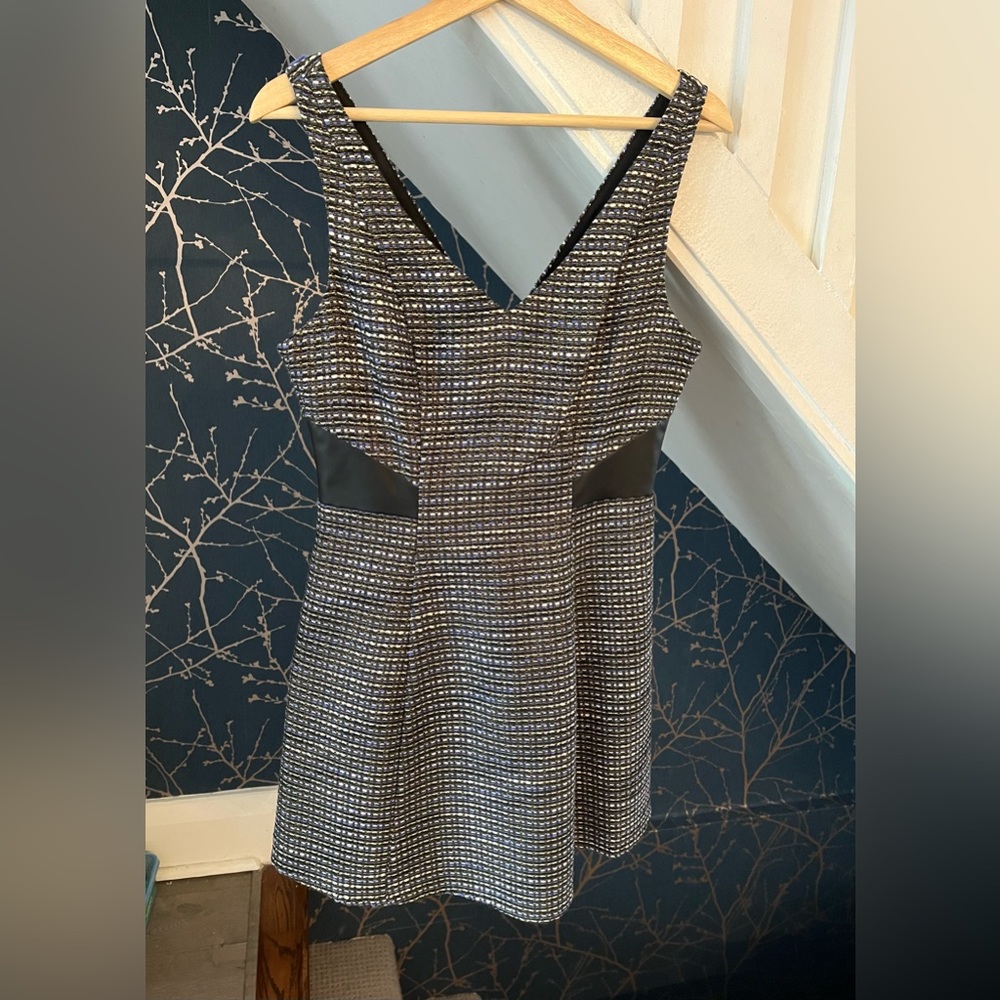 BCBGeneration mini dress with black leather trim. NEVER worn. Tag on. Size 4.